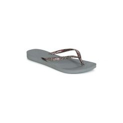 Japonki Havaianas SLIM LOGO METALLIC. Szare klapki damskie Havaianas, bez wzorów, bez obcasa. Za 90,30 zł.