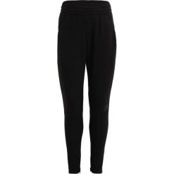 Adidas Performance Spodnie treningowe black/dgsogr. Czarne spodnie chłopięce adidas Performance, z elastanu. W wyprzedaży za 149,40 zł.