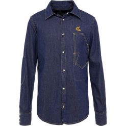 Vivienne Westwood Anglomania LARS WORKMAN Koszula blue denim. Niebieskie koszule męskie Vivienne Westwood Anglomania, s, bez wzorów, z bawełny, bez kołnierzyka, bez rękawów. Za 929,00 zł.