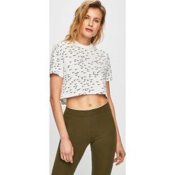 Nike - Top. Białe topy damskie Nike, s, bez wzorów, z bawełny, z okrągłym kołnierzem. Za 179,90 zł.