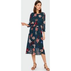 Elegancka sukienka. Sukienki damskie Greenpoint, bez wzorów, z poliesteru, eleganckie, bez kołnierzyka, bez rękawów. Za 99,99 zł.