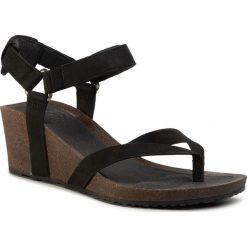 Sandały TEVA - Mahonia Wedge Thong 1110765 Blk. Czarne klapki damskie Teva, bez wzorów, ze skóry, bez obcasa, na koturnie. W wyprzedaży za 299,00 zł.