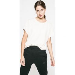 Puma - Top. Szare topy damskie Puma, m, z bawełny, z okrągłym kołnierzem. W wyprzedaży za 59,90 zł.