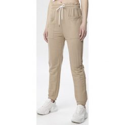 Beżowe Spodnie Raisea. Brązowe spodnie damskie Born2be, xl, z dzianiny, sportowe. Za 39,99 zł.