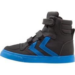 Hummel STADIL TONAL Tenisówki i Trampki wysokie black. Czarne trampki dziewczęce Hummel, ze skóry ekologicznej. W wyprzedaży za 161,85 zł.