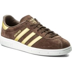 Buty adidas - Munchen CQ2320 Brown/Magold/Ftwwht. Pomarańczowe sneakersy męskie Adidas, na co dzień, bez wzorów, z zamszu, bez zapięcia. W wyprzedaży za 299,00 zł.
