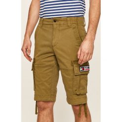 Tommy Jeans - Szorty. Zielone spodenki i szorty męskie Tommy Jeans, bez wzorów, z elastanu, casualowe. W wyprzedaży za 249,90 zł.