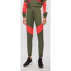 Tommy Sport - Spodnie. Spodnie damskie Tommy Sport, s, bez wzorów, z poliesteru. W wyprzedaży za 299,90 zł.