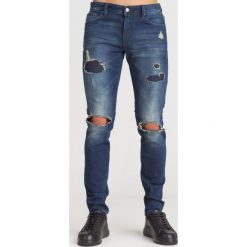 GRANATOWE JEANSY ARMANI EXCHANGE Z PRZETARCIAMI. Niebieskie jeansy męskie Armani Exchange, m, bez wzorów. Za 299,50 zł.