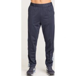 SPODNIE DRESOWE Armani Exchange. Niebieskie spodnie męskie Armani Exchange, na co dzień, s, bez wzorów, z dresówki. Za 609,00 zł.