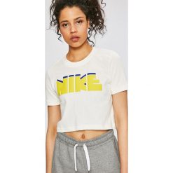 Nike Sportswear - Top. Białe topy damskie marki Nike Sportswear, l, z nadrukiem, z bawełny, z okrągłym kołnierzem. W wyprzedaży za 89,90 zł.