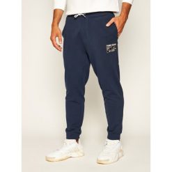 Spodnie dresowe Tommy Jeans Tjm Logo DM0DM08060. Niebieskie jeansy męskie Tommy Jeans, xl, bez wzorów. W wyprzedaży za 279,00 zł.