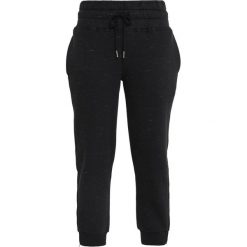 Adidas by Stella McCartney ESSENTIAL PANTS Spodnie treningowe black storm mel. Czarne bryczesy damskie marki adidas by Stella McCartney, xs, z bawełny. Za 379,00 zł.