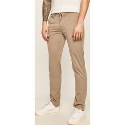 Pierre Cardin - Spodnie. Brązowe spodnie męskie Pierre Cardin, bez wzorów, z elastanu. Za 429,90 zł.