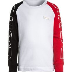 Converse COLOUR BLOCK COURT RAGLAN Bluzka z długim rękawem white. Białe bluzki dziewczęce Converse, z bawełny, z długim rękawem. Za 129,00 zł.