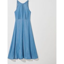 Sukienka maxi z lyocellu Eco Aware -. Sukienki damskie Mohito, bez wzorów, z lyocellu, bez kołnierzyka, bez rękawów, maxi. W wyprzedaży za 79,99 zł.