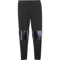 Legginsy z obracanymi cekinami bonprix czarny. Czarne spodnie dziewczęce bonprix, w paski. Za 44,99 zł.