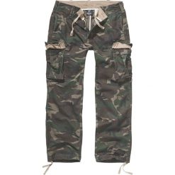 Brandit Heavy Weight Trouser Spodnie kamuflaż Woodland. Szare spodnie męskie marki Brandit, s, z aplikacjami, vintage, długie. Za 121,90 zł.