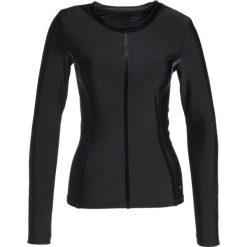 Puma NOCTURNAL Koszulka sportowa black. Czarne topy sportowe damskie marki Puma, m, z elastanu. W wyprzedaży za 254,25 zł.