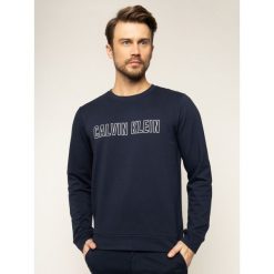 Bluza Calvin Klein Performance Pullover 00GMS0W367. Niebieskie bluzy męskie Calvin Klein Performance, m, bez wzorów, z bawełny, bez kołnierzyka, bez rękawów, bez kaptura. W wyprzedaży za 259,00 zł.