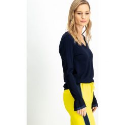 Sweter w kolorze granatowym. Niebieskie swetry damskie Garcia, m, bez wzorów, ze splotem, bez rękawów, bez kaptura. W wyprzedaży za 59,95 zł.