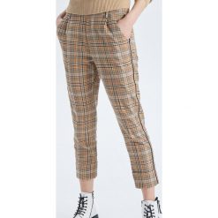 Spodnie chino w kratkę - Pomarańczowy. Pomarańczowe chinosy damskie marki Cropp, w kratkę. Za 99,99 zł.