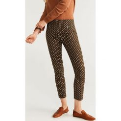 Mango - Spodnie Zippers. Żółte spodnie damskie Mango, bez wzorów, z elastanu, casualowe. Za 139,90 zł.