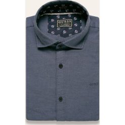 Guess Jeans - Koszula. Niebieskie koszule męskie s, z aplikacjami, z elastanu, casualowe. W wyprzedaży za 239,90 zł.
