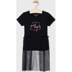 Guess Jeans - T-shirt dziecięcy 118-175 cm. Czarne bluzki dziewczęce Guess Jeans, z aplikacjami, z elastanu, z okrągłym kołnierzem, bez rękawów, bez kaptura. Za 129,90 zł.