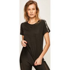 Puma - T-shirt. Czarne bluzki damskie Puma, s, z aplikacjami, z elastanu, z okrągłym kołnierzem. W wyprzedaży za 79,90 zł.