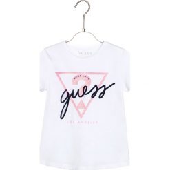 Guess Koszulka Biały. Białe podkoszulki damskie Guess, z nadrukiem, z elastanu, bez kołnierzyka, z krótkim rękawem. Za 87,95 zł.