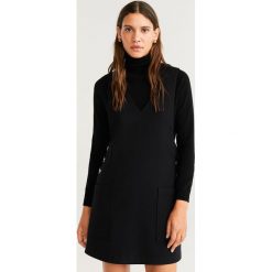 Mango - Sukienka Janice. Czarne sukienki damskie Mango, na co dzień, s, bez wzorów, z elastanu, casualowe, bez kołnierzyka, bez rękawów, mini, proste. Za 139,90 zł.