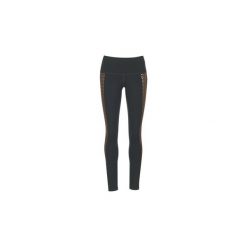 Legginsy i Rajstopy Puma EVERYDAY TRAIN GRAPHIC TIGHT. Czarne pończochy i rajstopy Puma. Za 223,20 zł.