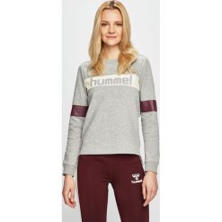 Hummel - Bluza. Białe bluzy damskie Hummel, s, z nadrukiem, z elastanu, bez rękawów, bez kaptura. W wyprzedaży za 119,90 zł.