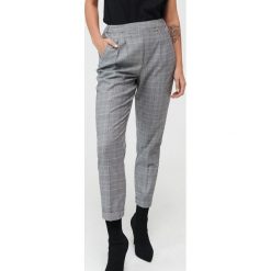 Spodnie jogger w kratkę -. Spodnie damskie Mohito. Za 99,99 zł.