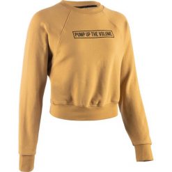 Bluza crop do tańca miejskiego damska. Pomarańczowe bluzy damskie DOMYOS, bez wzorów, z elastanu, z krótkim rękawem, krótkie, bez kaptura. Za 89,99 zł.