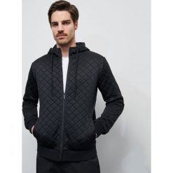 Bluza z recyklingowanego poliestru - Czarny. Czarne bluzy męskie Reserved, s, bez wzorów, bez kołnierzyka, bez rękawów, bez kaptura. Za 159,99 zł.