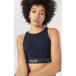 Granatowy Top Daemnara. Niebieskie topy sportowe damskie Born2be, s, bez wzorów, bez rękawów. Za 29,99 zł.