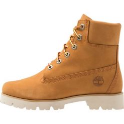 Timberland HERITAGE LITE 6IN BOOT Botki na platformie wheat. Żółte botki damskie lity marki Timberland, z materiału, na sznurówki. Za 759,00 zł.