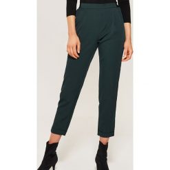 Spodnie chino - Turkusowy. Niebieskie chinosy damskie House. Za 79,99 zł.