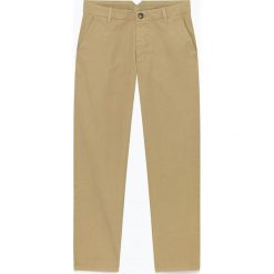 Spodnie "Kelia" w kolorze beżowym. Brązowe spodnie męskie American Vintage, na co dzień, m, w paski, z bawełny. W wyprzedaży za 219,95 zł.
