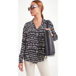 KOSZULA OSPITE SPORTMAX CODE. Koszule damskie Sportmax Code, bez wzorów, eleganckie, bez kołnierzyka, bez rękawów. Za 879,00 zł.