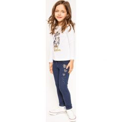 Blukids - Jeansy dziecięce 98-128 cm. Niebieskie jeansy dziewczęce marki Blukids, z bawełny. W wyprzedaży za 69,90 zł.