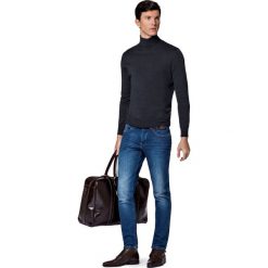 Jeansy Brooklyn. Niebieskie jeansy męskie LANCERTO, s, z haftami, vintage. W wyprzedaży za 299,90 zł.