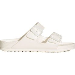Klapki BIRKENSTOCK ARIZONA EVA. Różowe klapki damskie Birkenstock, bez wzorów, ze skóry, na wysokim obcasie. Za 180,00 zł.