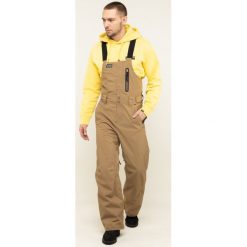 Spodnie narciarskie Billabong North West Stx Bib Q6PM05 BIF9. Pomarańczowe spodnie męskie Billabong, s, bez wzorów, z poliesteru, sportowe. W wyprzedaży za 599,00 zł.