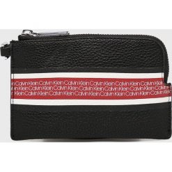 Calvin Klein - Portfel. Czarne portfele damskie marki Calvin Klein, ze skóry ekologicznej. Za 179,90 zł.