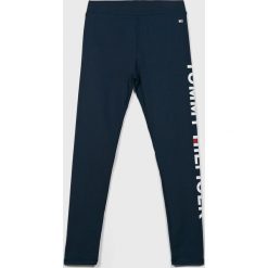 Tommy Hilfiger - Legginsy dziecięce 128-176 cm. Niebieskie spodnie dziewczęce TOMMY HILFIGER, z nadrukiem, z elastanu. W wyprzedaży za 199,90 zł.