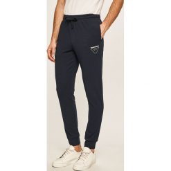 Emporio Armani - Spodnie. Niebieskie spodnie męskie Emporio Armani, s, bez wzorów, z elastanu. Za 419,90 zł.