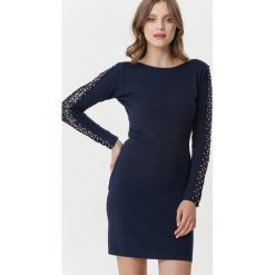Granatowa Sukienka Lugarno. Niebieskie sukienki damskie Born2be, xl, bez wzorów, z dzianiny, z okrągłym kołnierzem, z długim rękawem, długie, mini, dopasowane. Za 119,99 zł.